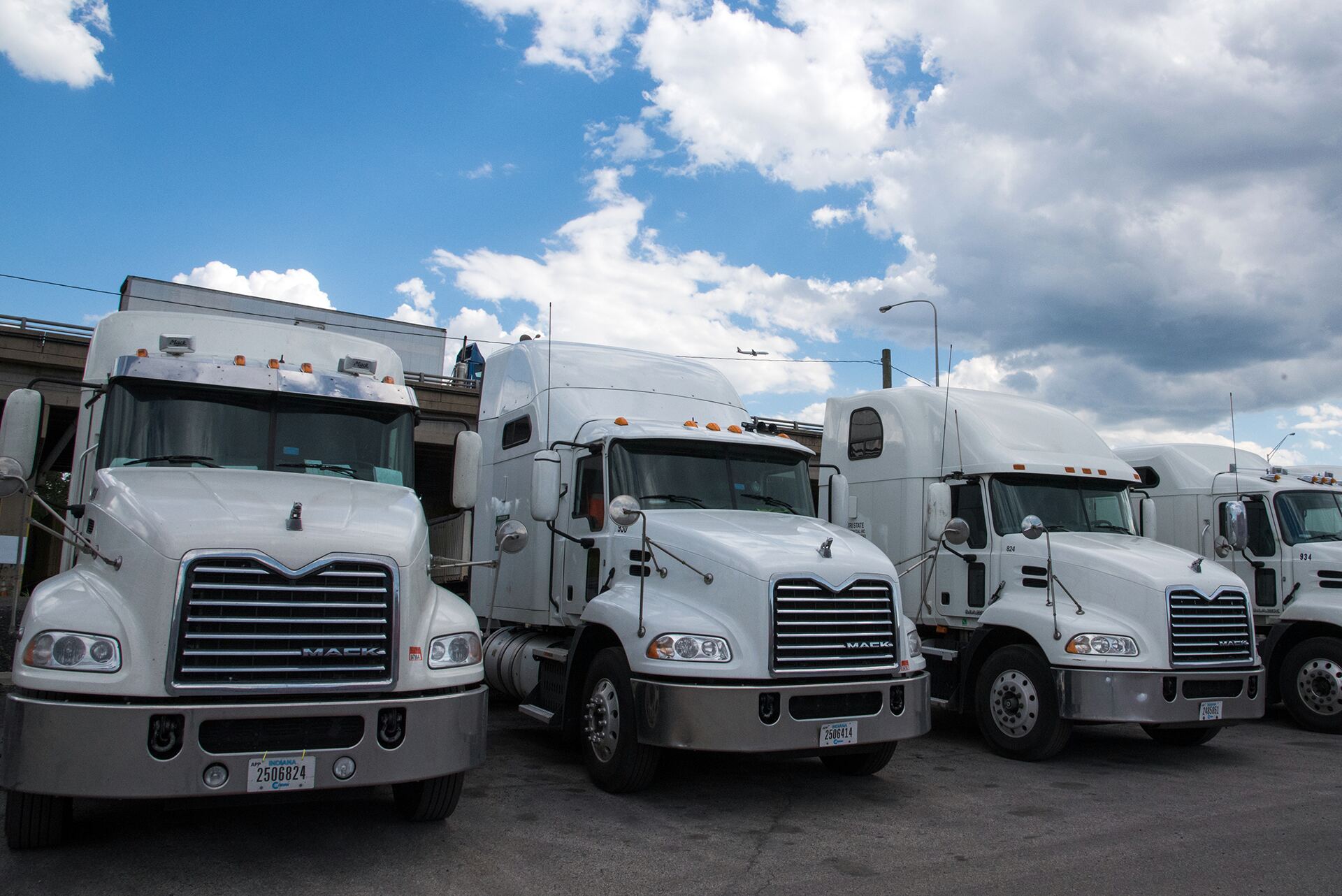 Tri State Intermodal fleet of white Mack trucks